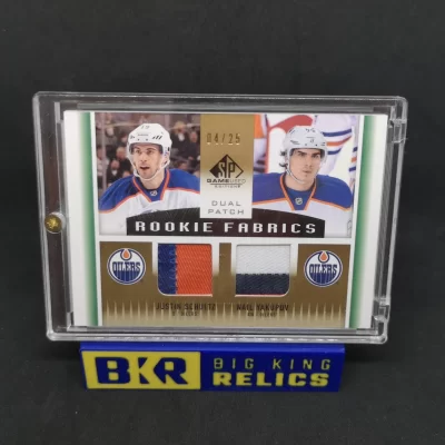 2013-14 SP Game Used Rookie Fabrics Dual Patches #RF2SY Justin Schultz Nail Yakupov /25 NHL kártya